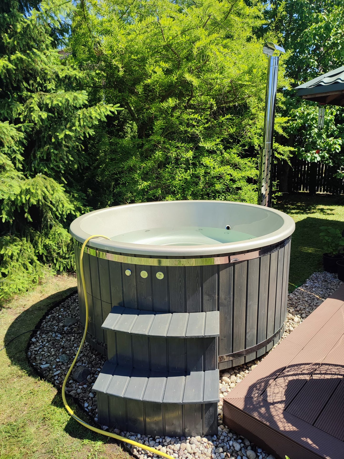 Hot tub with external stove